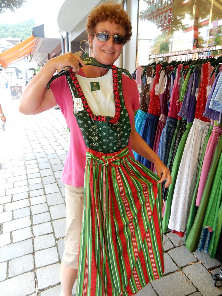 Laura holds up a dirndl in Bad Ischl.  Local women  wore these.  The men wore liederhosen.