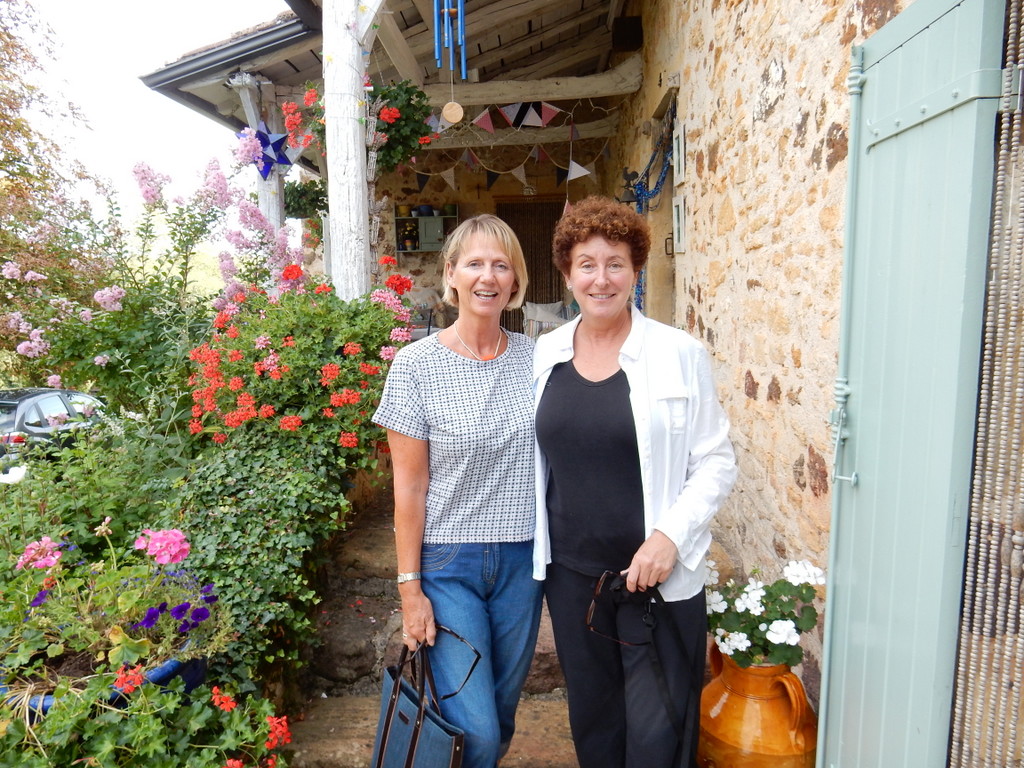Melinda and Laura in front of Melinda's home in Fongalop