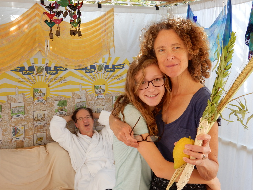 Diane, Jonathan, and Kalya in the sukkah behind their home in Jerusalem