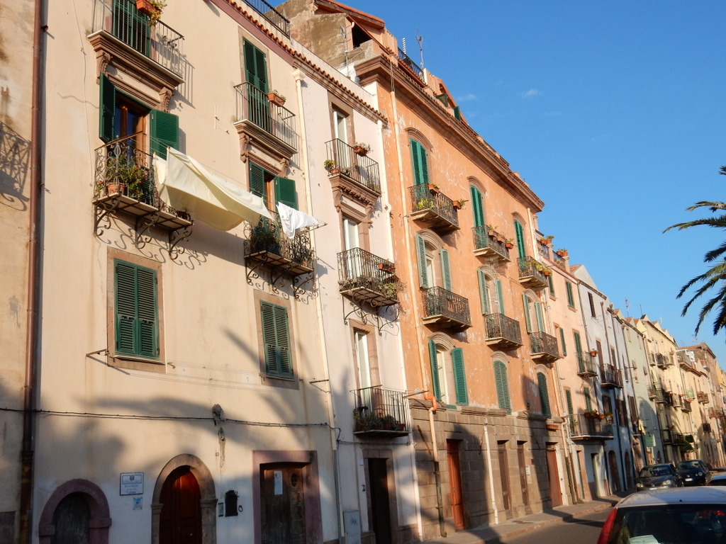 Buildings in Bosa are in lively colors, often have wrought iron balconies, and decorated entrances.